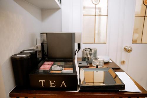 a coffee maker on a table in a room at Hotel Seehof Norderney OHG in Norderney
