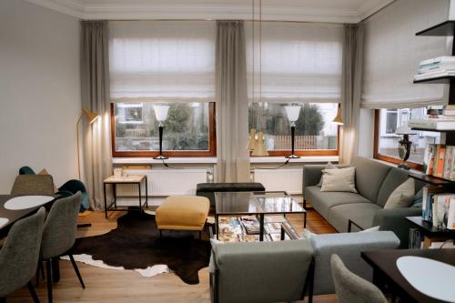 a living room with a couch and a table at Hotel Seehof Norderney OHG in Norderney