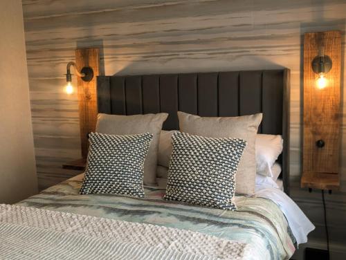a bedroom with a bed with pillows on it at Hesketh Hotel in Blackpool