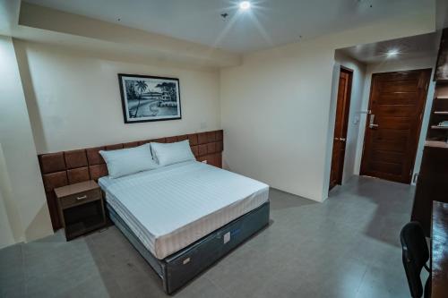 Postel nebo postele na pokoji v ubytování Hotel Monicon