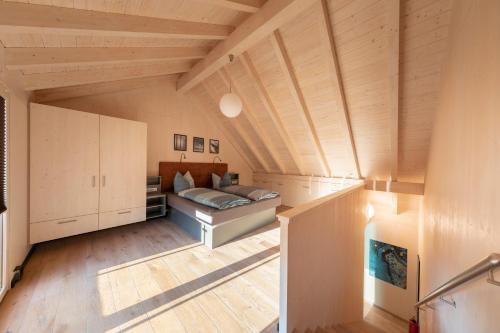 a large room with a bed and wooden ceilings at Aktiv-Urlaub-Burak Marktleuthen im Fichtelgebirge in Marktleuthen