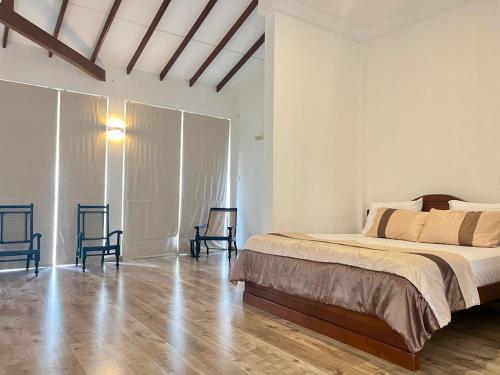 Ένα ή περισσότερα κρεβάτια σε δωμάτιο στο Tangalle Serenity Bungalow
