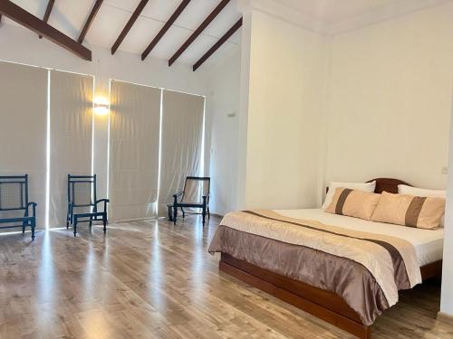 Ένα ή περισσότερα κρεβάτια σε δωμάτιο στο Tangalle Serenity Bungalow