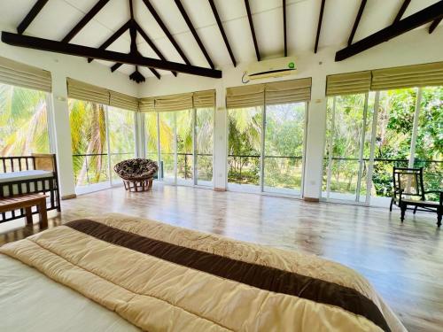 Ένα ή περισσότερα κρεβάτια σε δωμάτιο στο Tangalle Serenity Bungalow