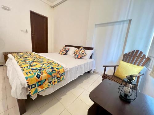 Ένα ή περισσότερα κρεβάτια σε δωμάτιο στο Tangalle Serenity Bungalow