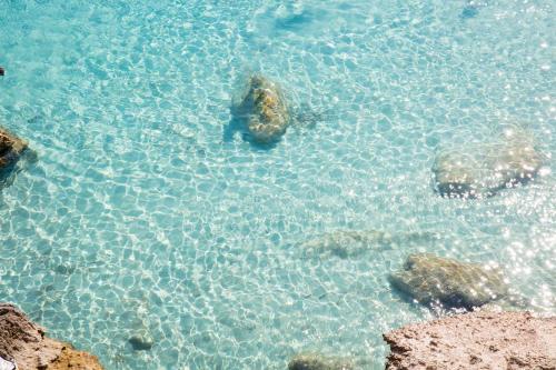 an aerial view of the ocean with rocks in the water at Il Borgo Del Principino in Favignana