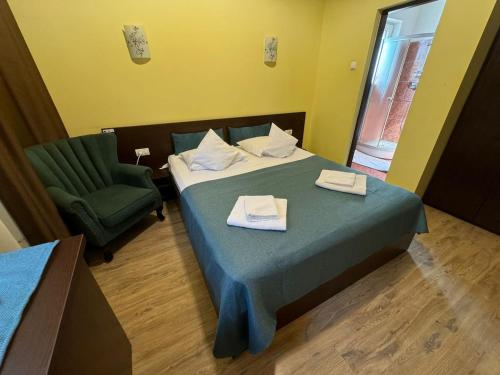 Postel nebo postele na pokoji v ubytování TOMIS Pensiune