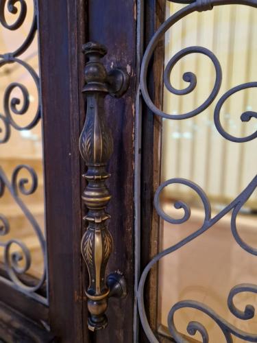 a close up of a wooden door with a metal gate at Riva Luxury Suites in Split