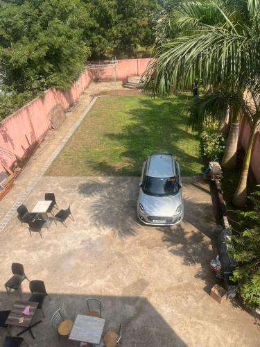 a silver car parked in a parking lot at Sandeep's Homestay in Mohurli