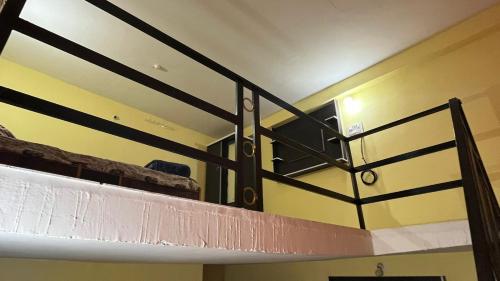 a room with a bunk bed in a room at Sandeep's Homestay in Mohurli