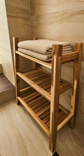a wooden shelf with a mattress on top of it at Apartmán na Krajzontě in Polná