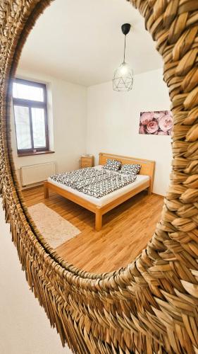 a bedroom with a bed in a room at Apartmán na Krajzontě in Polná