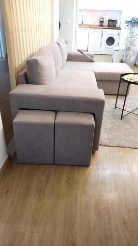 a living room with a couch and a table at El pilar a 7 minutos in Zaragoza