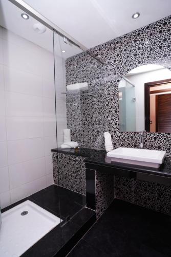 Koupelna v ubytování Hotel La Capitale