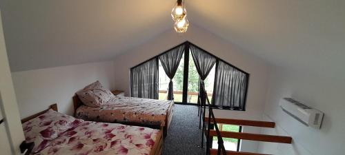 Postel nebo postele na pokoji v ubytování SIP-POL Domki nad Liswartą