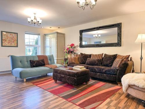 a living room with a couch and a table at Perfect Getaway in Canterbury in Canterbury