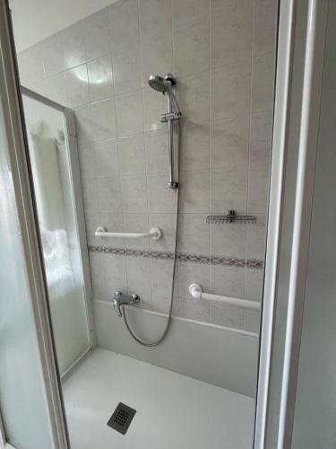 a bathroom with a shower with a glass door at Casa San Francesco in Mondragone