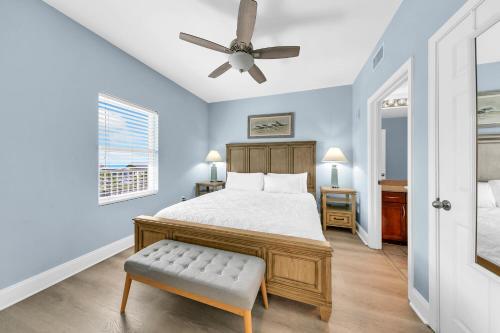 a bedroom with a bed and a ceiling fan at Laketown Wharf 317 in Panama City Beach