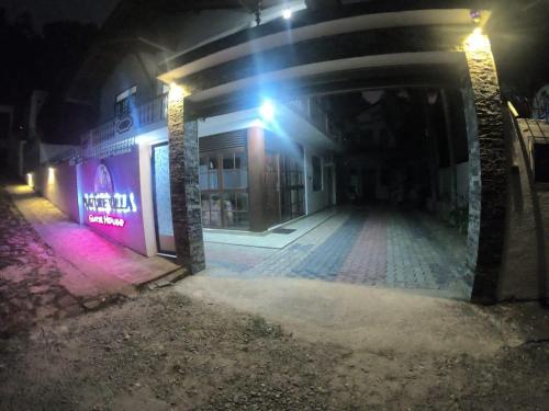 an empty street at night with a building at Nature Villa Guest House in Matara