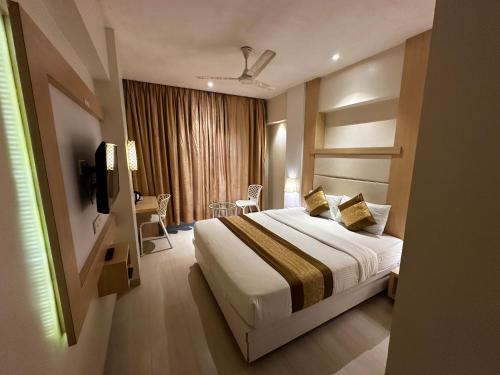 Letto o letti in una camera di South Coast Hotel Wagle Estate Thane