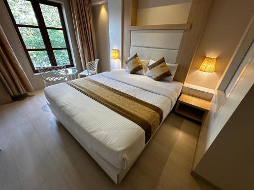 Letto o letti in una camera di South Coast Hotel Wagle Estate Thane