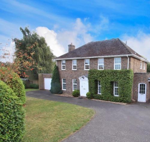 a large brick house with ivy growing on it at Perfect Getaway in Canterbury in Canterbury