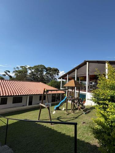 a playground in front of a building at Villa Paulina in Guadalupe