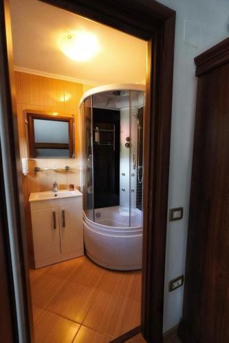 a bathroom with a shower and a sink at Montebello in Predeal