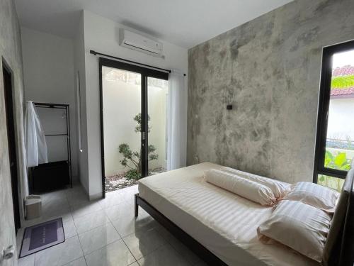 Postel nebo postele na pokoji v ubytování Matari House