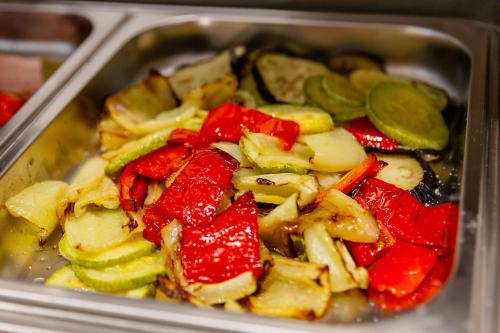 a metal container filled with vegetables in at Hotel Boka in Kotor