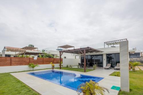 a swimming pool in the backyard of a house at Tills Beach Resort in Fetta