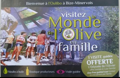 a magazine with a picture of a group of people at La Villa Du Menhir Chambre d'hôtes in Bize-Minervois