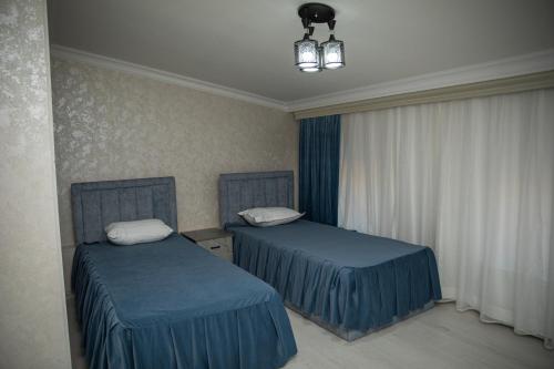 Letto o letti in una camera di Welldone HOTEL