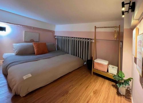 a bedroom with a large bed in a room at Glorious CENTRAL Loft - Near BenThanh Market - Walk to METRO in Ho Chi Minh City