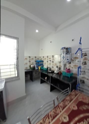 a room with a bunch of animals in a room at Diya Homestay in Rāmpur Hāt