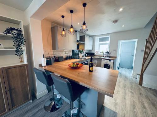 a kitchen with a large wooden counter top in a room at Keekle Cottage - 2 Bedrooms - Sleeps 4 in Cleator Moor