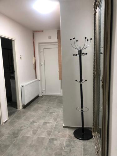 a hallway with a large mirror and a tile floor at Apartman Slavica self check in,private parking in Osijek