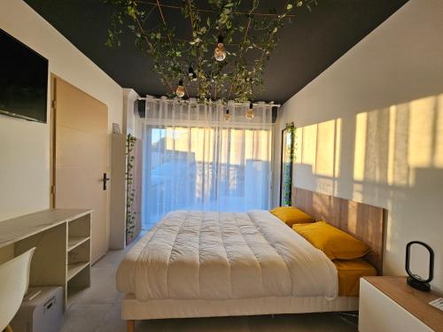 En eller flere senge i et værelse på Evasion balneo