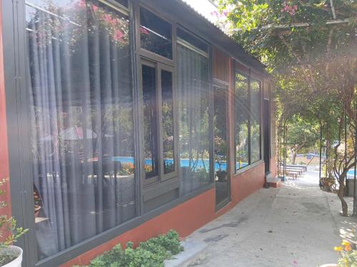 a group of windows on the side of a building at Catba Papillon Garden Bungalows & Resort in Cat Ba