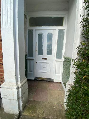 a white front door of a house with at The Florence Room in Norwood