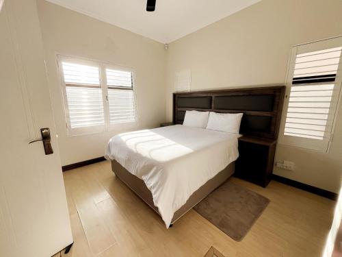 Ένα ή περισσότερα κρεβάτια σε δωμάτιο στο CasaCalme Guest House