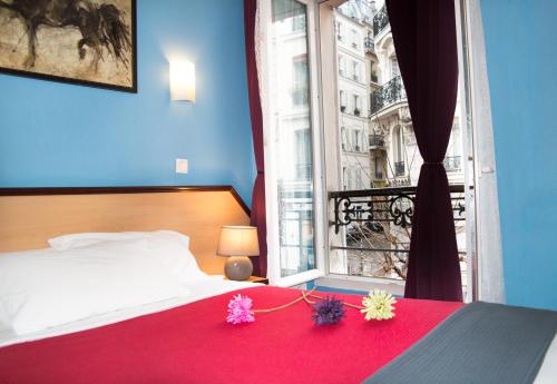 Кровать или кровати в номере Hotel Audran