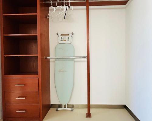 a room with a surfboard in a closet at Experience tranquility and comfort accommodation, near main attractions in Riviera Maya in Lafitte