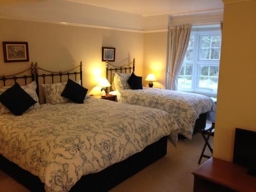 מיטה או מיטות בחדר ב-Clayhill House Bed & Breakfast