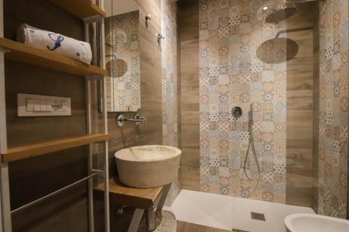 a bathroom with a sink and a shower at Nilu al Mare - Villa pool & sea Monopoli in Monopoli