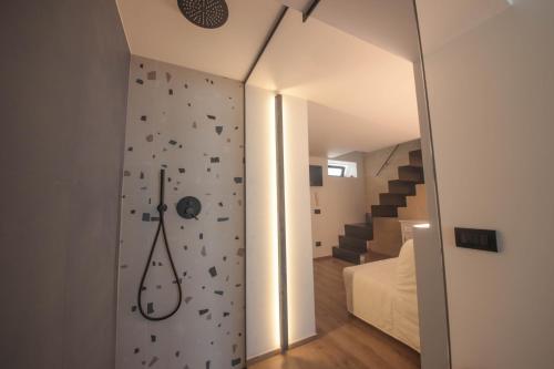 a room with a rock climbing wall and a bedroom at Nilu al Mare - Villa pool & sea Monopoli in Monopoli