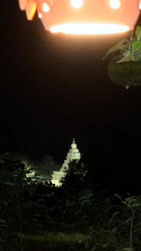 a night view of a building with a street light at Sri Murugan Beach Paradise Hotel in Mahabalipuram