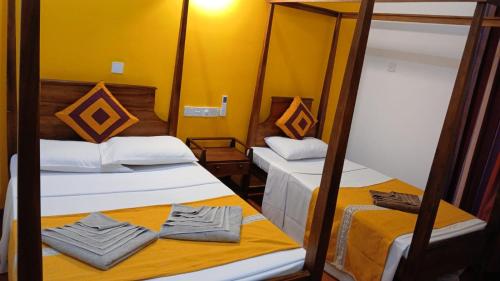 Postel nebo postele na pokoji v ubytování Luxe Hiriketiya