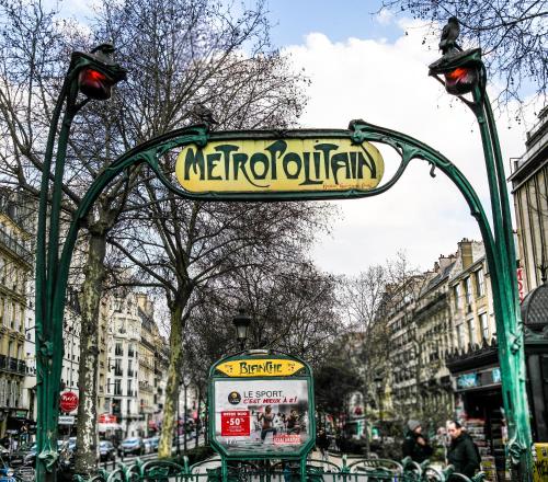 a sign on a street in a city at Hotel Audran in Paris