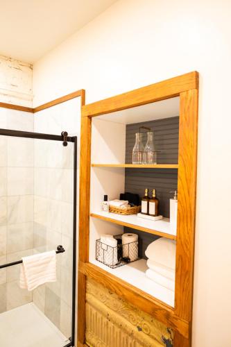 a bathroom with a shower and a glass door at Lander Millhouse in Lander